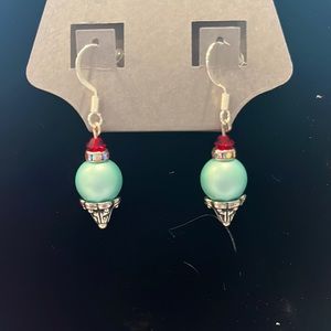 teal ice cream earrings with whip cream and cherry on it